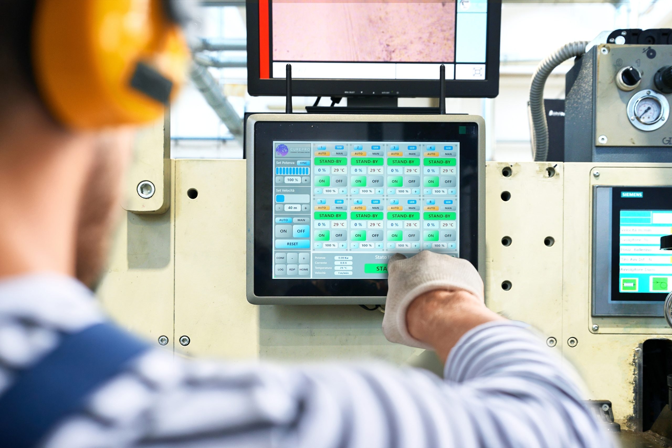 Close-up of a Siemens HMI panel showing display quality and touch surface